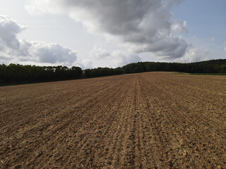 Agriculture land with brown soil in the countryside