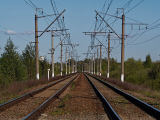 Fototapeta na wymiar The rails of the railway run away over the horizon.