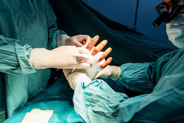 Performing a surgical procedure in a sterile operating room. 