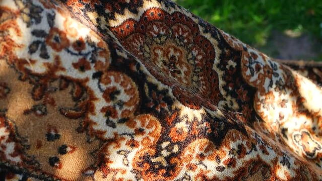 carpet texture. pattern on the carpet. set and shadow on the carpet. Close-up of the woolen fabric texture and woven Iranian rug artistic design.