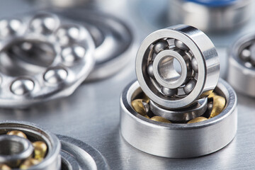 Obraz premium different bearings on a metal background. Part of mechanism.