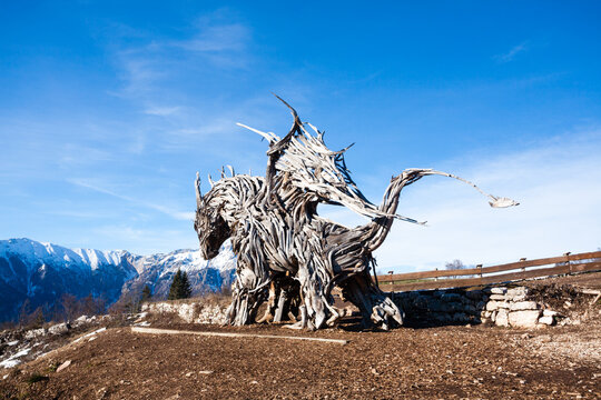 Wooden sculpture of a dragon. Italian landmark