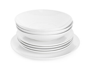 Stack of beautiful ceramic plates and bowls isolated on white