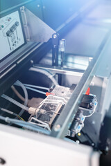 Construction parts of a biochemistry analyzer in a laboratory.