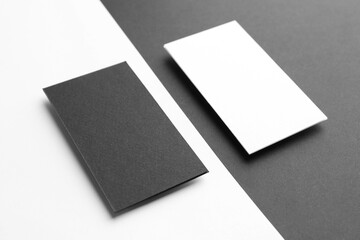 Blank business cards on color background. Mockup for design