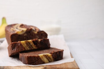 Delicious homemade banana bread on table, closeup. Space for text