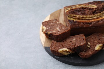 Delicious banana bread on grey table, closeup. Space for text