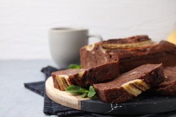 Delicious banana bread served on grey table, closeup