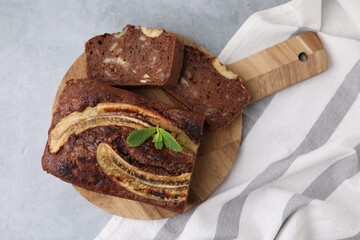 Delicious banana bread on grey table, top view