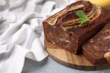 Delicious banana bread on grey table, closeup
