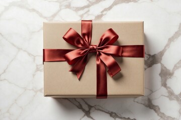 luxury gift box with shiny red bow on marble background, present decor