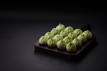 Raw khinkali or green dumplings with salt, spices and herbs