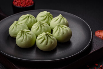 Raw khinkali or green dumplings with salt, spices and herbs