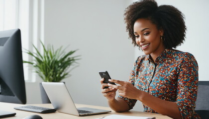 Joyful black woman is engaged in networking or social media activities on her phone in the office - obrazy, fototapety, plakaty