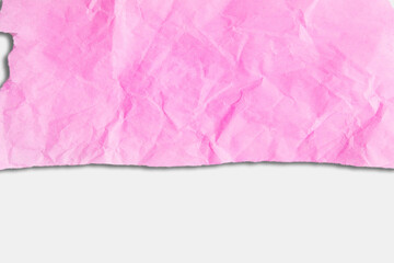 Scrap of crumpled pink paper on light   background