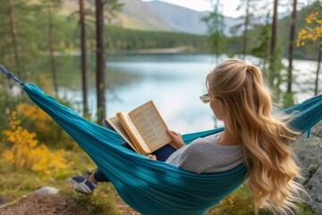 A tranquil woman escapes into nature, swaying in a hammock surrounded by trees, plants, and the soothing sound of a nearby lake as she indulges in a good book - obrazy, fototapety, plakaty