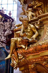 Fototapeta na wymiar Kanzel in Dom St. Stephan with gilded wooden figures in Passau, famous baroque bishop's church, Passau, Lower Bavaria, Germany