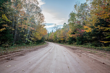 Red dirt road in autumn in Prince Edward Island 