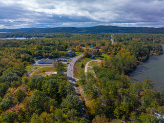 Naklejka premium Whittier Highway aerial view in fall including with White Mountain at the background in town of Moultonborough, New Hampshire NH, USA. 