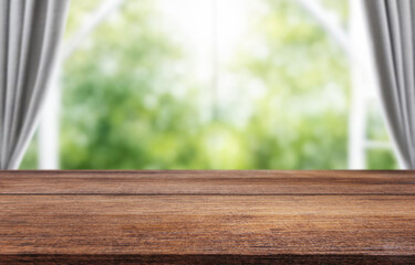 Wooden table on window background with garden and trees