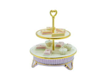 Antique porcelain china afternoon cake stand with gold gilt edging and delicate ornamental cakes on...