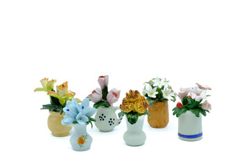 Antique Miniature Flower Ornaments bone china in the shape of baskets jugs and vases of different colours of flowers.
