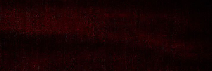 Panoramic surface of burgundy fabric denim grunge texture dark tone. Banner, background design images. Blank copy space Close-up