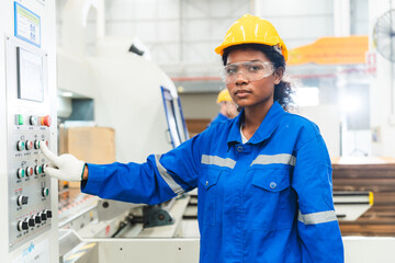 Portrait female professional engineer factory in protective uniform operating machine, Engineering...