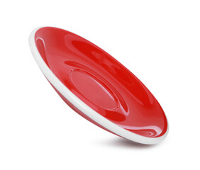 One red ceramic saucer isolated on white