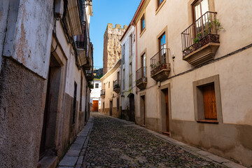 Narrow picturesque street in the medieval town of Caceres in Extremadura.
