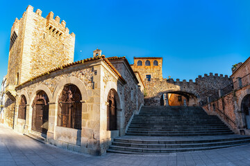 A group of medieval buildings next to the main square of Caceres, a World Heritage Site
