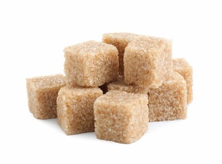 Many brown sugar cubes isolated on white