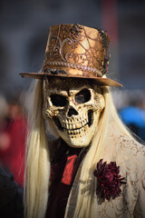 Masked person during the first day of the Venice carnival