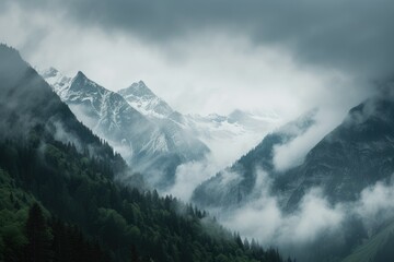 Breathtaking view of majestic snow-capped mountains with jagged peaks, contrasted against smooth cloudy skies. A serene and captivating alpine landscape