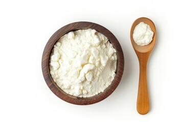 Bird s eye view of spoon and bowl of corn starch on white background