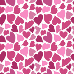 Pink hearts on white backdrop seamless pattern. Creative art texture for printing on various surfaces or use in graphic design projects.