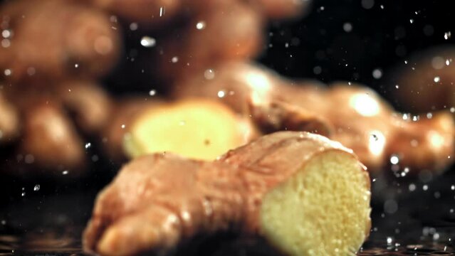 A knife cuts through fresh ginger. Filmed on a high-speed camera at 1000 fps. High quality FullHD footage