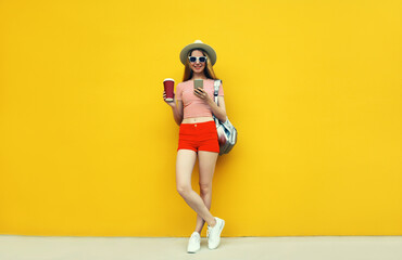 Summer image of traveler young woman 20s with mobile phone looking at device - obrazy, fototapety, plakaty