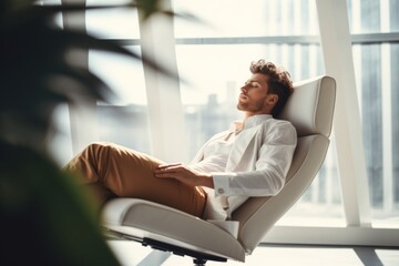 Relaxed man in modern office taking a break