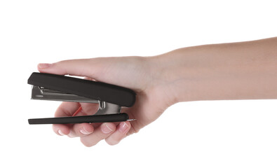 Woman holding black stapler on white background, closeup