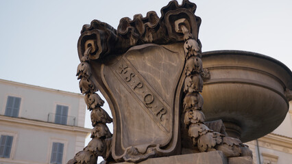 Spqr plate on a monument in the square of Rome 