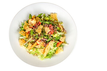 A salad with romaine lettuce cheese cracker and different seeds.