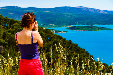 Tourist take photo from Lake Sainte Croix, Verdon Gorge, France