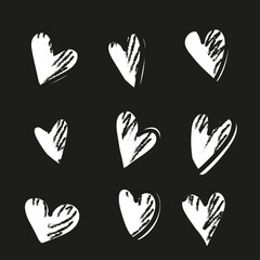 Obraz premium Vector set with hand drawn hearts on black background. 