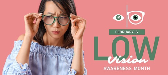 Beautiful Asian woman in eyeglasses on pink background. February is Low Vision Awareness Month