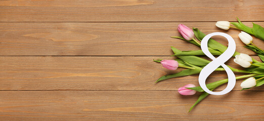 Paper figure 8 and beautiful tulips on wooden background with space for text. International Women's Day
