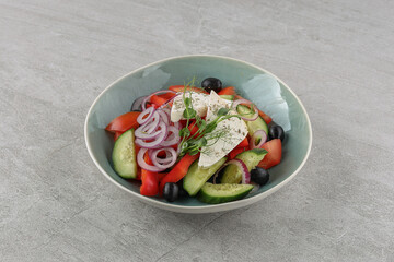 Greek salad on a stone background studio shooting 4