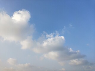 blue sky with creamy clouds