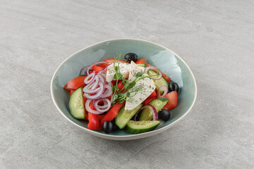 Greek salad on a stone background studio shooting 2