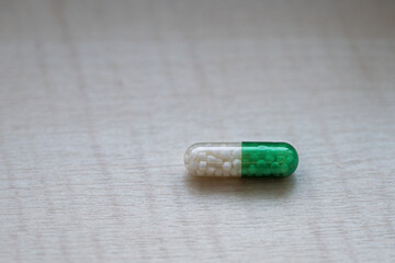 Greenish-white cylindrical powder in detail.